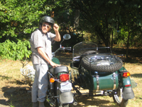Jim with his 2006 Ural (Russian) side car motorcycle. The three wheel drive is great for rough terrain and back exploring with his dog, Princess, in the side  car. 
